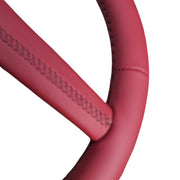 Close-up of stitching where the spoke meets the rim on a 4-spoke Sport steering wheel wrap, view 2