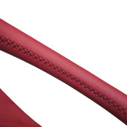 Close-up of the laced rim seam on a 4-spoke Sport steering wheel wrap