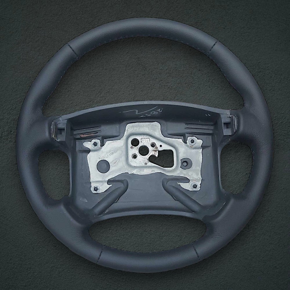 Black leather 4-spoke steering wheel wrap with thumbgrips for 1990-1992 Camaro, view 2