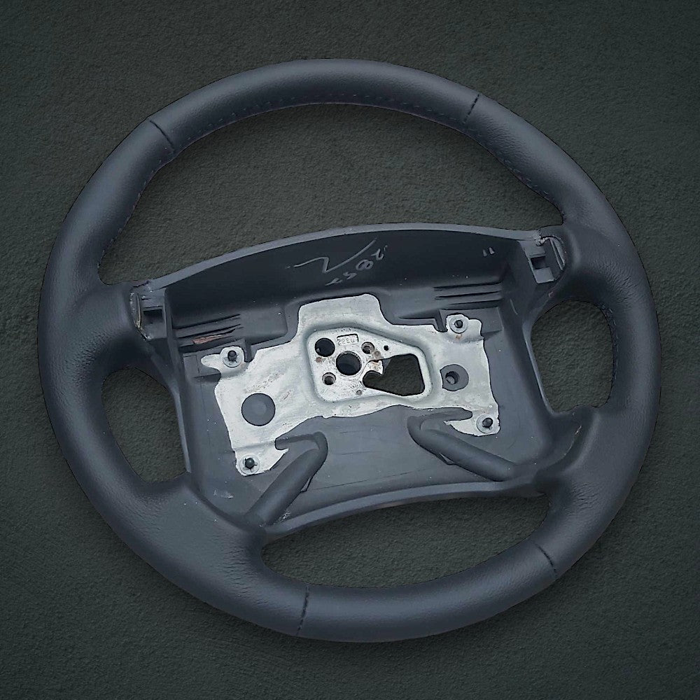 Black leather 4-spoke steering wheel wrap with thumbgrips for 1990-1992 Camaro, view 3
