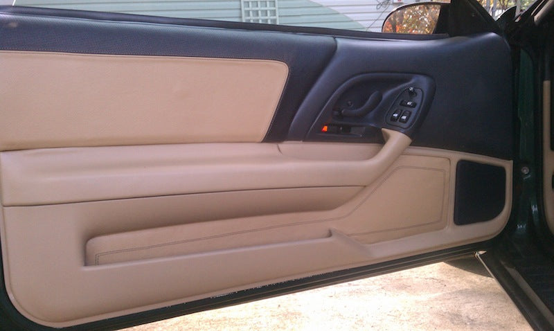 Tan leather door insert and panel covers installed in a 4th-gen Camaro