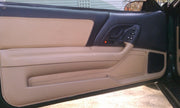 Tan leather door insert and panel covers installed in a 4th-gen Camaro