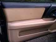 Tan leather door insert and panel covers installed in a 4th-gen Camaro, view 2