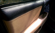 Tan leather upper door panel cover installed in a 4th-gen Camaro, view 3
